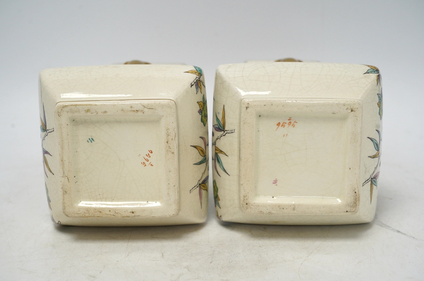 A pair of Christopher Dresser Old Hall crackleware Japanese inspired vases with gilt decorated elephant handles, 24cm high. Condition - good